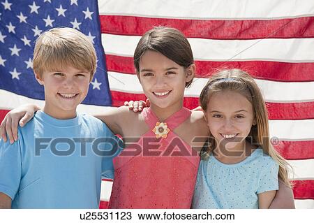 Three children in front of an American flag View Large Photo Image Stock Image - Three children in front of an American flag. Fotosearch
