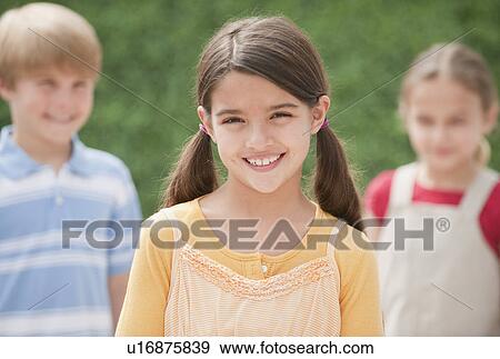 Three children outdoors View Large Photo Image Stock Photo - Three children outdoors. Fotosearch
