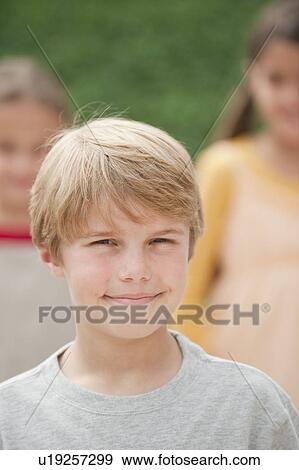 Three children outdoors View Large Photo Image Stock Photo - Three children outdoors. Fotosearch
