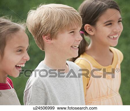 Stock Photo - Three children outdoors. Fotosearch