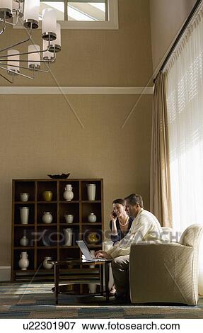 Two business people in a lobby View Large Photo Image Stock Photo - Two business people in a lobby. Fotosearch