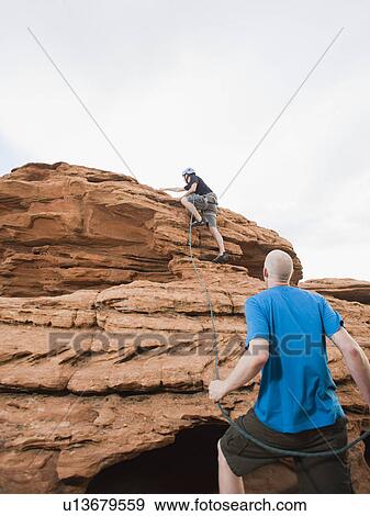 Stock Photo - Two rock climbers at Red Rock. Fotosearch
