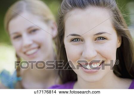 Two sisters outdoors View Large Photo Image Picture - Two sisters outdoors. Fotosearch