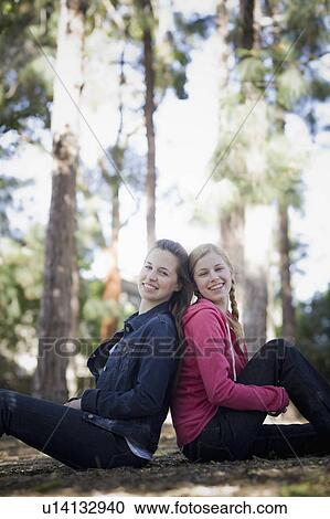 Stock Image - Two sisters outdoors. Fotosearch