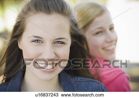 Stock Image - Two sisters outdoors. Fotosearch