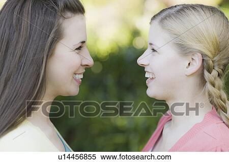 Two sisters outdoors View Large Photo Image Stock Photography - Two sisters outdoors. Fotosearch