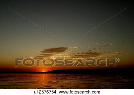 Picture - A beautiful sunset/sunrise. Fotosearch