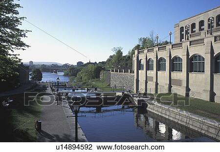 Stock Image - A canal by buildings. Fotosearch