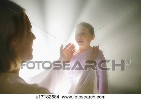 A child with an angel View Large Photo Image Picture - A child with an angel. Fotosearch