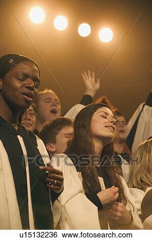 A choir sings View Large Photo Image Stock Photograph - A choir sings. Fotosearch