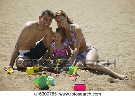 A family on the beach View Large Photo Image Stock Photography - A family on the beach. Fotosearch
