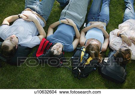 Picture - A group of young people napping. Fotosearch