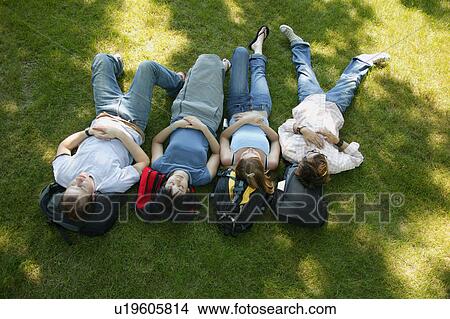 Picture - A group of young people napping. Fotosearch