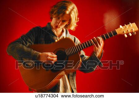 Picture - A guitar player. Fotosearch
