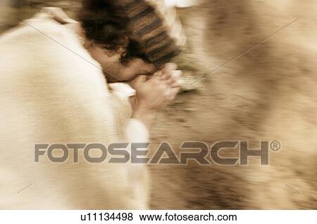 A man prays View Large Photo Image Stock Photo - A man prays. Fotosearch
