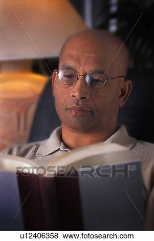 Stock Photo - A man reading. Fotosearch