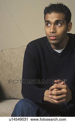 Stock Image - A man thinks and waits. Fotosearch