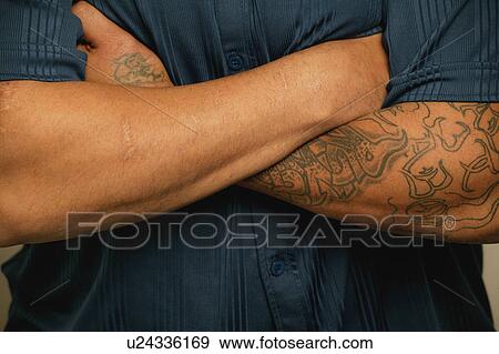 A man with a tattoo View Large Photo Image Stock Photo - A man with a tattoo. Fotosearch