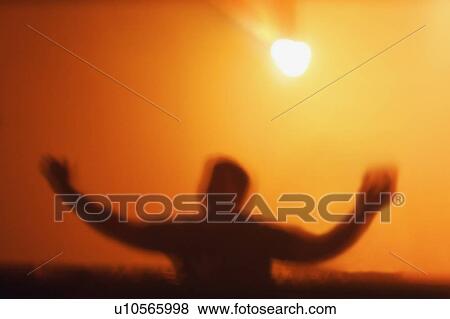 A person under bright light View Large Photo Image Stock Photo - A person under bright light. Fotosearch