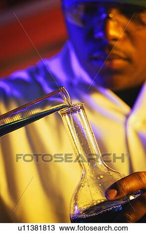 Stock Image - A scientist in a laboratory. Fotosearch