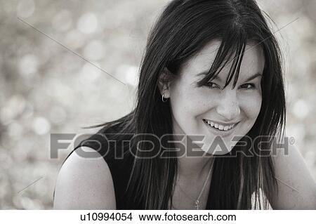 A woman smiles View Large Photo Image Picture - A woman smiles. Fotosearch