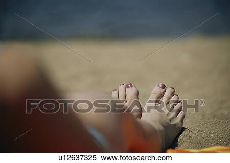 A woman's feet on a beach View Large Photo Image Stock Photography - A woman's feet on a beach. Fotosearch