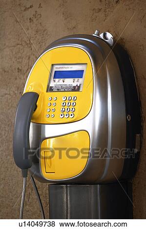 A yellow pay phone View Large Photo Image Stock Photo - A yellow pay phone. Fotosearch