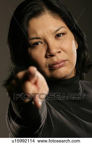 Picture - Aboriginal woman pointing. Fotosearch