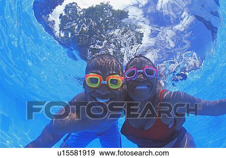 Adult couple in swimming pool View Large Photo Image Stock Photo - Adult couple in swimming pool. Fotosearch
