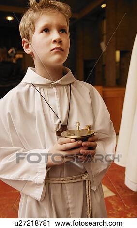 Alter boy holding container View Large Photo Image Stock Image - Alter boy holding container. Fotosearch