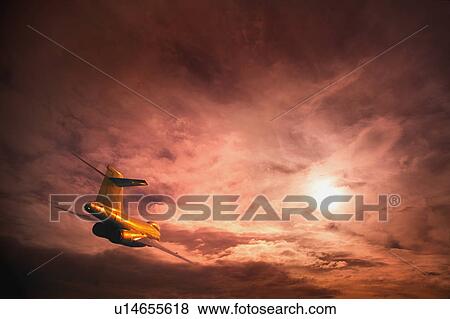 Stock Photo - An airplane in the sky. Fotosearch
