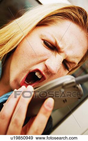 Stock Photo - An angry phone call. Fotosearch