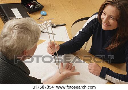 An occupational therapist at work View Large Photo Image Picture - An occupational therapist at work. Fotosearch