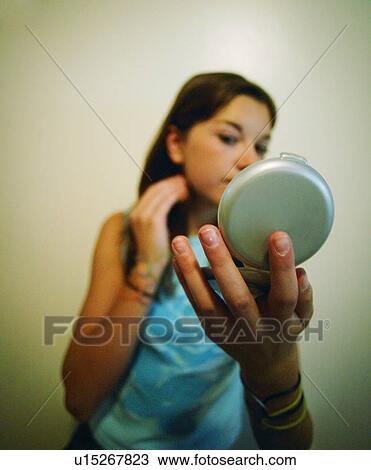 Stock Image - Applying makeup. Fotosearch