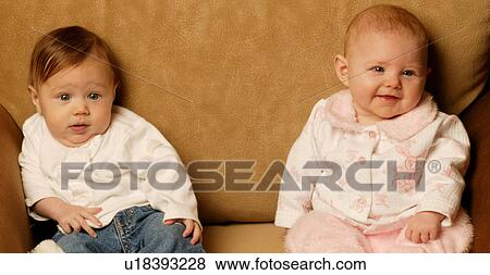 Stock Photo - Babies sitting together. Fotosearch