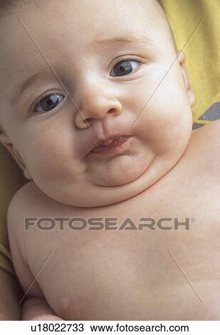 Stock Image - Baby making faces. Fotosearch