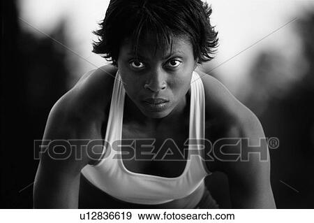 Black and white of woman at sprinter's starting blocks View Large Photo Image Stock Photo - Black and white of woman at sprinter's starting blocks. Fotosearch