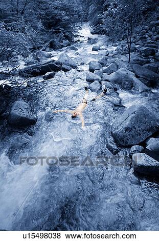 Body in a stream View Large Photo Image Stock Photo - Body in a stream. Fotosearch