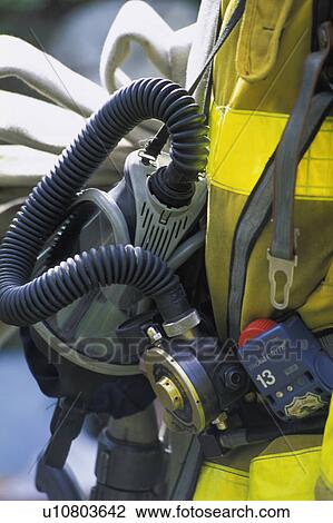 Stock Image - Body of fireman with firefighting equipment. Fotosearch