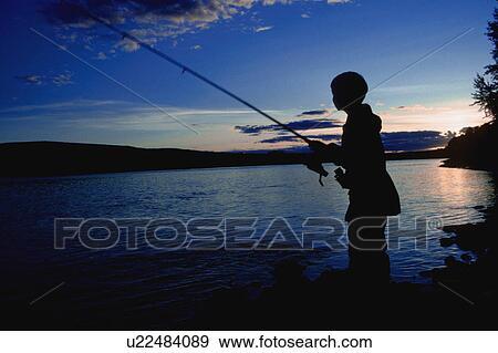 Boy fishing in river View Large Photo Image Stock Photo - Boy fishing in river. Fotosearch