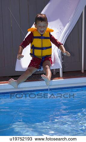 Boy on waterslide View Large Photo Image Stock Image - Boy on waterslide. Fotosearch