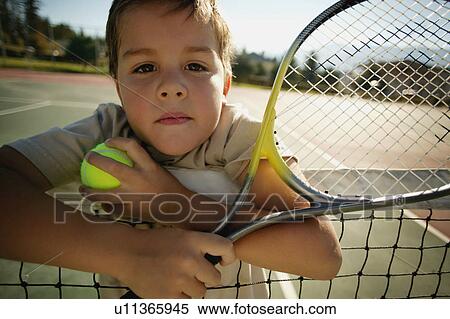 Boy with tennis racket View Large Photo Image Stock Photography - Boy with tennis racket. Fotosearch