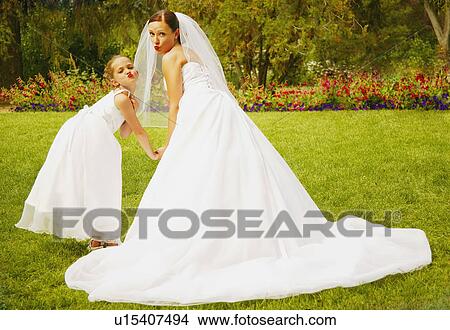 Bride and flower girl View Large Photo Image Picture - Bride and flower girl. Fotosearch