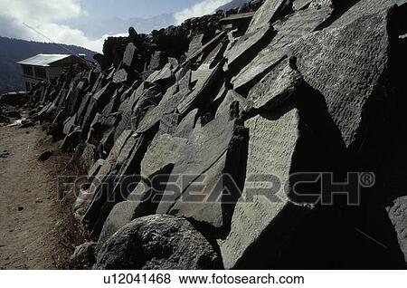 Broken carved stones alongside path View Large Photo Image Stock Photo - Broken carved stones alongside path. Fotosearch