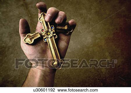 Broken cross in hand View Large Photo Image Stock Image - Broken cross in hand. Fotosearch