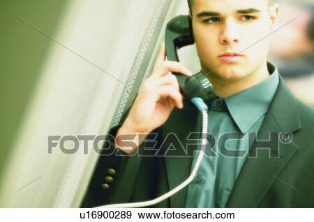 Stock Photo - Business man on telephone. Fotosearch