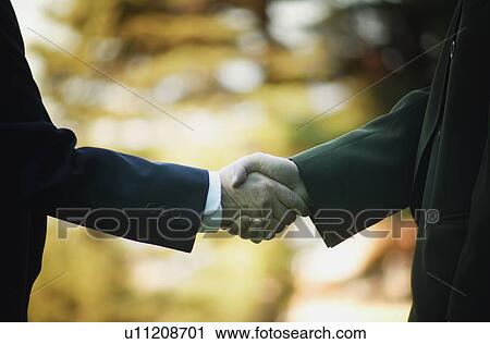 Stock Image - Businessman handshake. Fotosearch