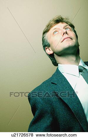 Stock Photo - Businessman looking up. Fotosearch