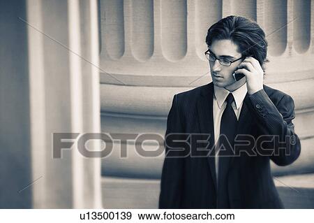 Stock Photo - Businessman on cell phone. Fotosearch