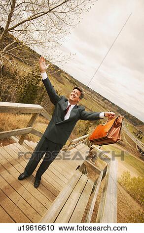 Stock Image - Businessman on top of the world. Fotosearch